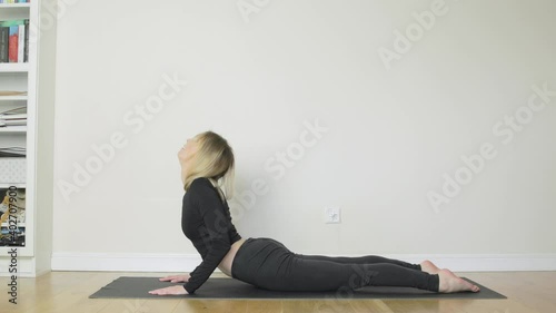 An out of shape woman struggles to get started on her New Year's Resolution of exercising.