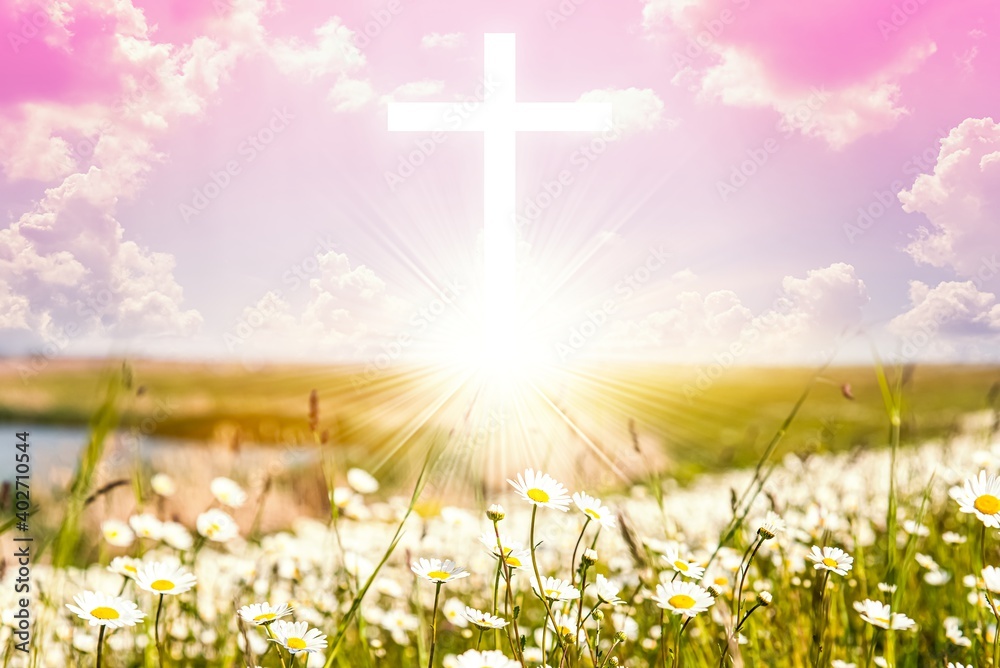 Cross against the sky, beautiful flowers