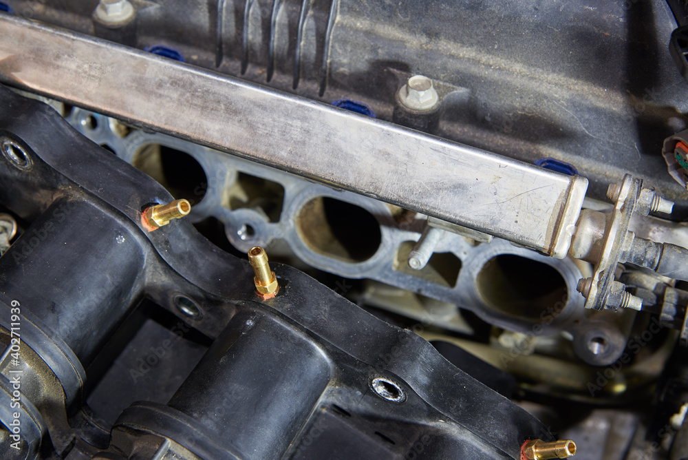 Car engine, intake manifold, connection of LPG injectors. Car engine, intake manifold, connection of LPG injectors.
