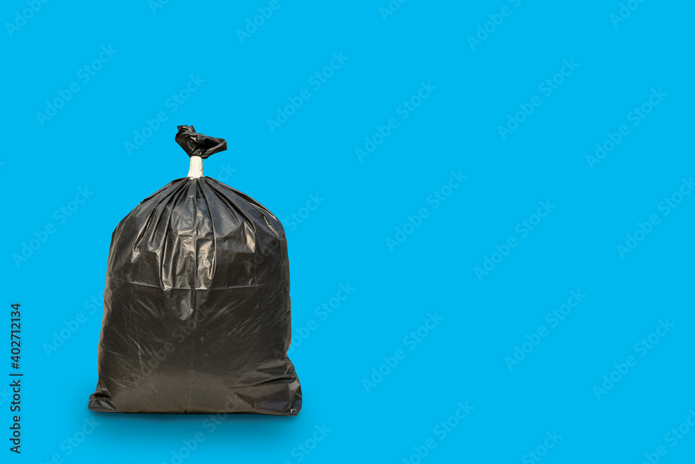 Close up of a garbage bag isolated on blue background with clipping path and copy space. Close up of a garbage bag isolated on blue background with clipping path and copy space.