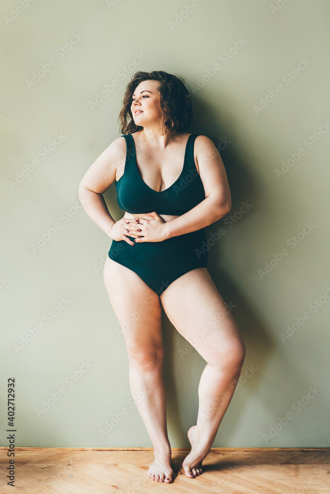 Beautiful plus size woman relaxing in underwear. Beautiful plus size woman relaxing in underwear.