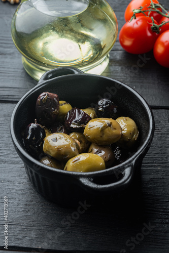 Spain olives, on black wooden table