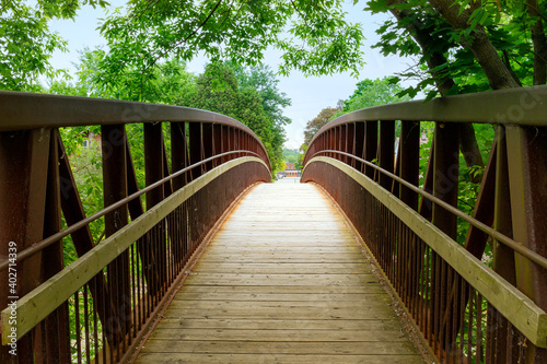 Ontario Park Trails are one of the most beautiful and more extensive of Canada. Here the wood bridge over the Grand River, Paris, Ontario, Canada