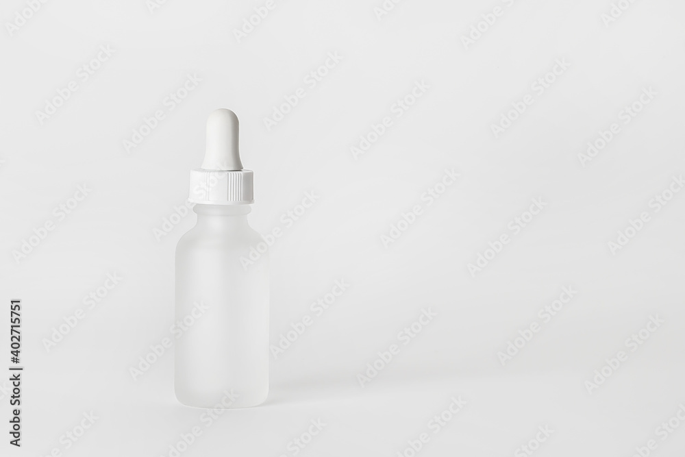 Hyaluronic acid bottle on a light background.. Hyaluronic acid bottle on a light background..