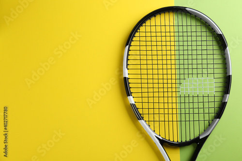 Tennis racket on color background, top view. Space for text © New Africa