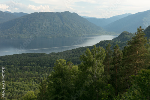 Lake Teletskoye with calm water on a summer day .Altai territory