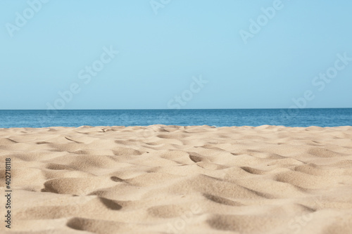 Beautiful sandy beach and sea on sunny day. Summer vacation