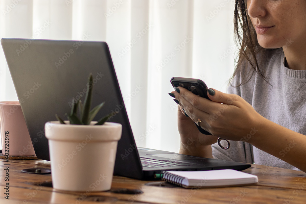 brazilian young woman working from home with laptop