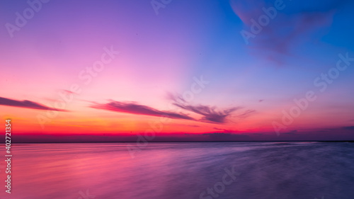 sunset over the sea torn clouds the sun has already gone over the horizon © Samarskyi Serhii