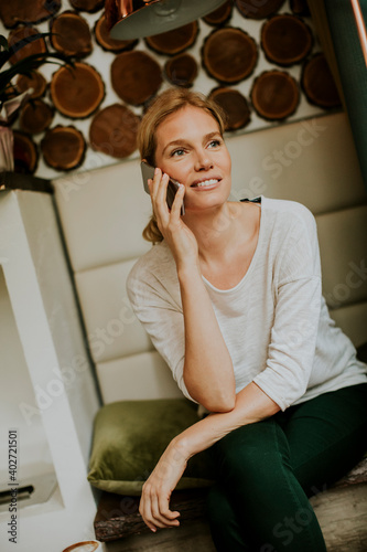 Pretty young woman sitting ...