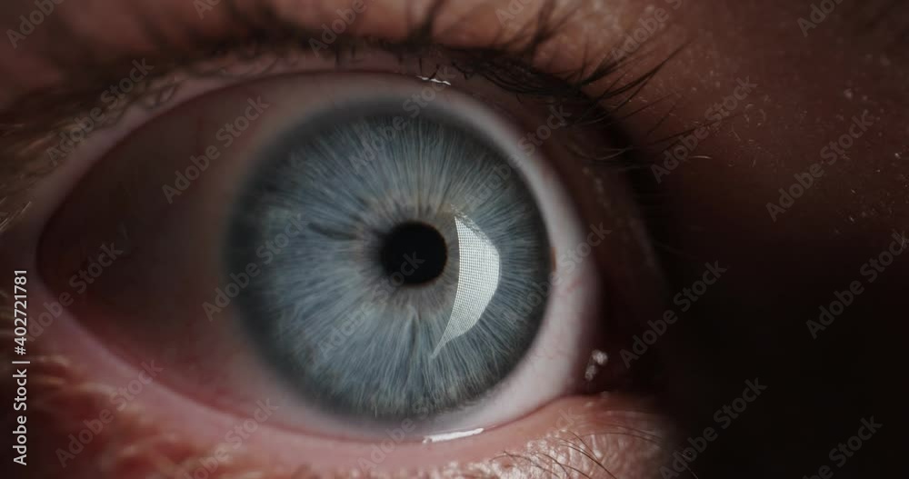 Red Eye with blue iris of tired guy looking around in complete