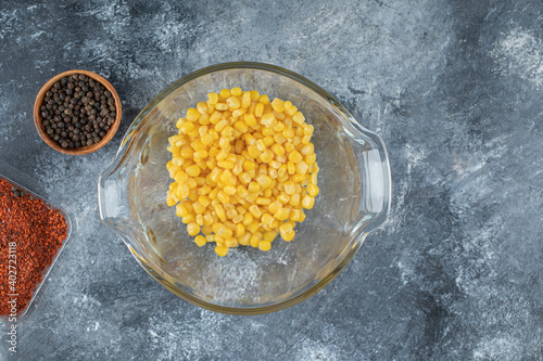 Bowl of sweet corns on marble background
