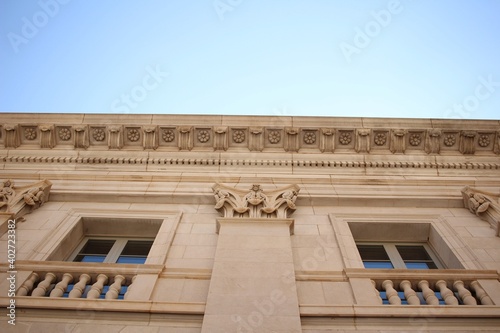 Old Ornate Beige Historic Building Against Blue Sky