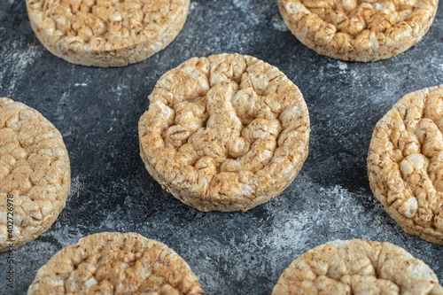 Pile of round crispbread on marble background