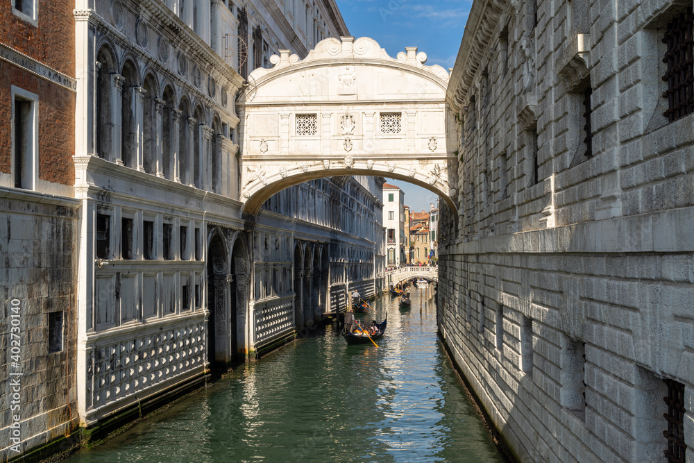 VENICE, ITALY - 07 November 2015: Image with Gondolas at Bridge oh Sights in Venice. Ponte dei Sospiri, medieval mediterranean landmark of Italy