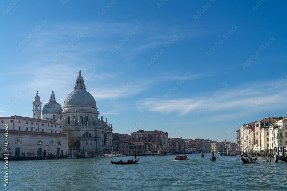 Venice, Italy, 07 November 2015, the Grand canal, the Cathedral of Santa Maria della Salute and gondolas with tourists