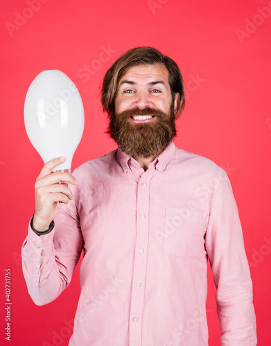 smiling man hold big lamp. got new idea. concept of creativity. man just inspired. economy of electricity. bright minded hipster. creative inspiration. light your way. bearded man with bulb