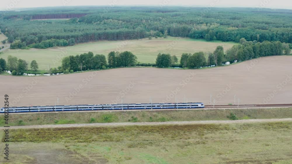 Regional train passing the scenic surrounding in Poland
