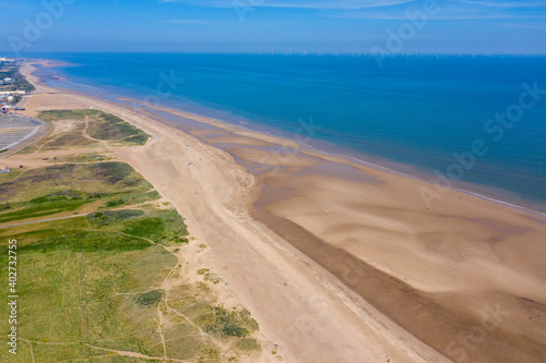 Aerial photo of the beautiful beach in the town of Skegness showing the large sandy beach and clear blue ocean on a beautiful sunny summers say © Duncan