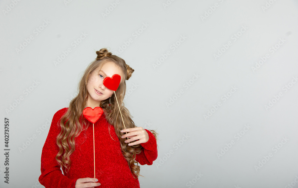 Cute teen girl with hearts on Valentine's Day