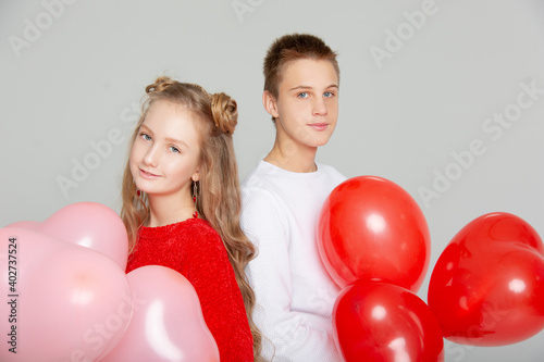 Cute couple in love with schoolchildren on Valentine's Day © MARIYA