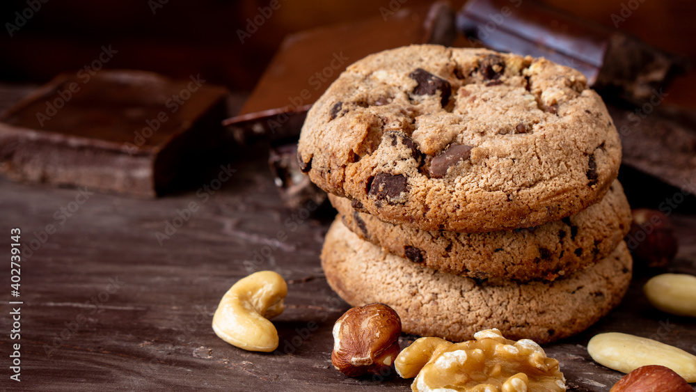 Organic food snack tasty sweet dessert milk dark chocolate chip salt cookie closeup piece fruit orange raspberry hazelnut nuts cinnamon on cocoa cacao powder wooden table for new year Christmas gift Organic food snack tasty sweet dessert milk dark chocolate chip salt cookie closeup piece fruit orange raspberry hazelnut nuts cinnamon on cocoa cacao powder wooden table for new year Christmas gift