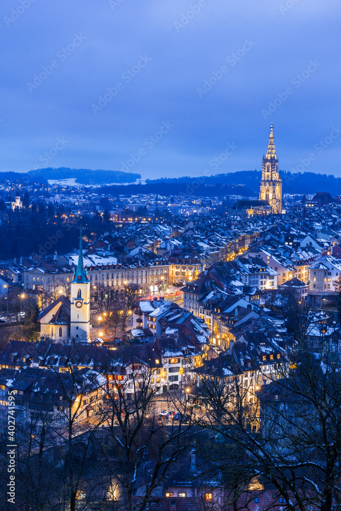 Old town of Bern in winter blue hour with snowy and illuminated buildings, Bern, UNESCO, Switzerland