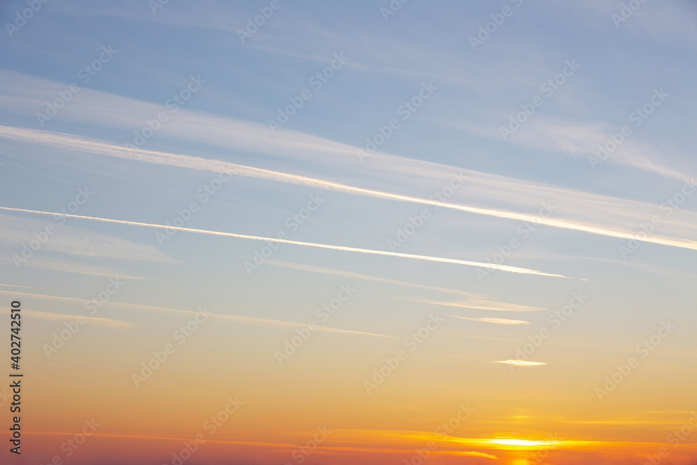 sky landscape, winter clouds with a setting orange sun