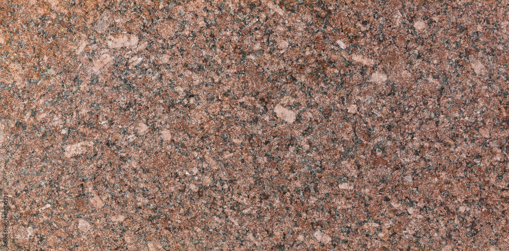 Granite New Imperial red, heat-treated. Closeup seamless pattern and texture of high quality Granite New Imperial red, heat-treated. Closeup seamless pattern and texture of high quality