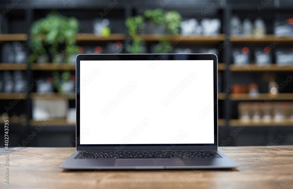 Laptop mockup template with empty screen against shelving Laptop mockup template with empty screen against shelving