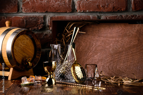 Set of bar or pub accessories with martini cocktail shaker. Set for the bartender Bar spoon, jiger, strainer photo