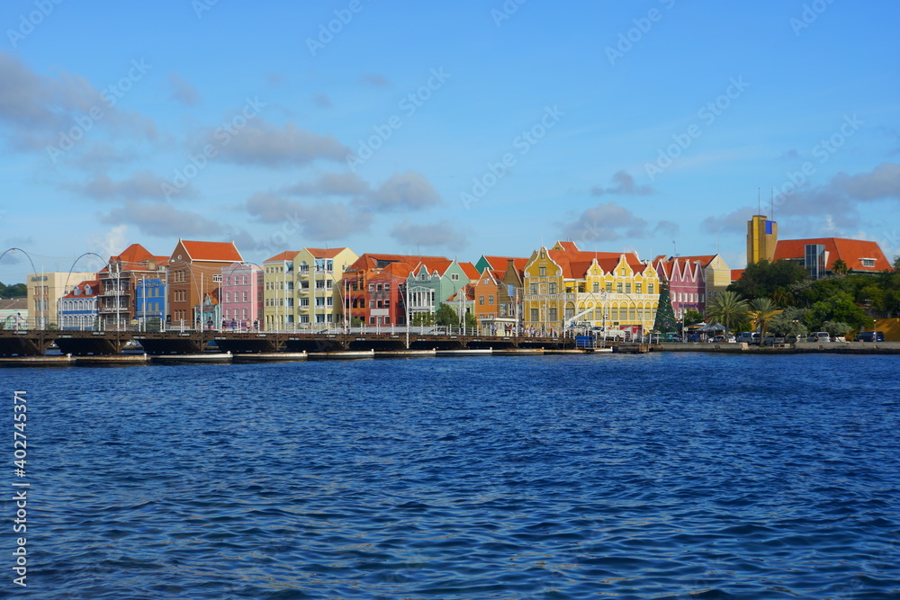 Fototapeta premium The view of the colorful buildings along the St Anna Bay during the day near Willemstad, Curacao