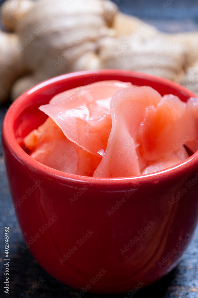 Asian food, pink sliced pickled ginger roots ready to eat Asian food, pink sliced pickled ginger roots ready to eat
