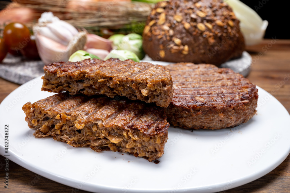 Grilled plant based, meat free vega burgers close up Grilled plant based, meat free vega burgers close up