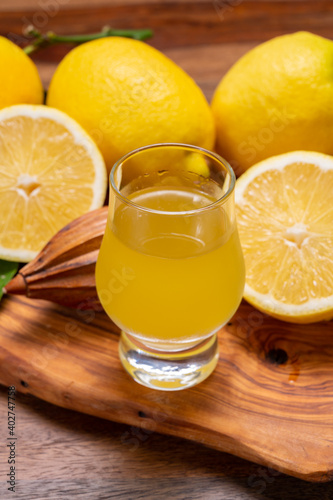 Ice cold sweet limoncello liqueur made from new harvest of fresh ripe yellow Italian lemons, Amalfi coast, Italy photo