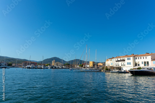Fototapeta Naklejka Na Ścianę i Meble -  Travel and vacation destination, view on houses, roofs, canals and boats in Port Grimaud, Var, Provence, French Riviera, France