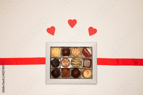 Chocolate candies in box flat lay. Valentine's day gift.  © Alona
