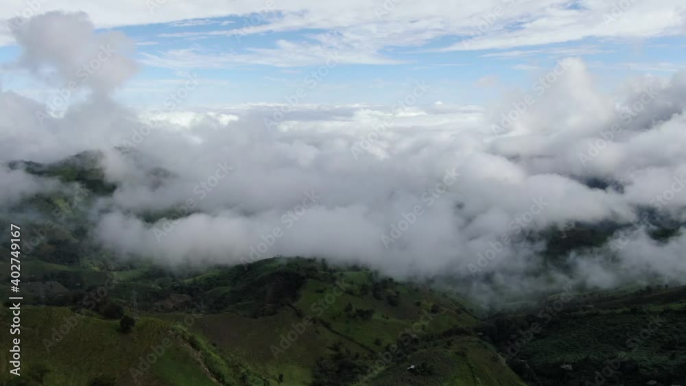 Aerial shot of mountains and clouds Aerial shot of mountains and clouds