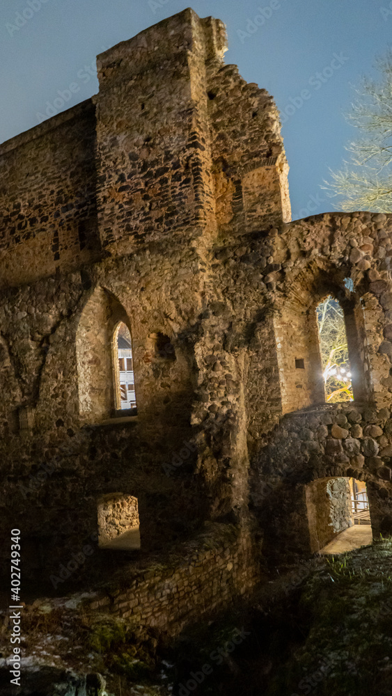 Ruins of Sigulda Medieval Castle, Latvia. Old Fortress Cristmas Time Night Shot.