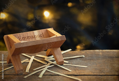 Billede på lærred Original faith based Christmas photograph of a wooden manger with the word Emman