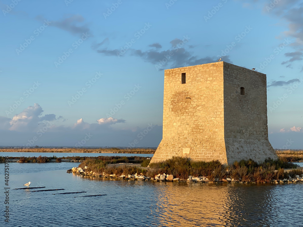 Beautiful and colorful sunset in the lake with tower Beautiful and colorful sunset in the lake with tower