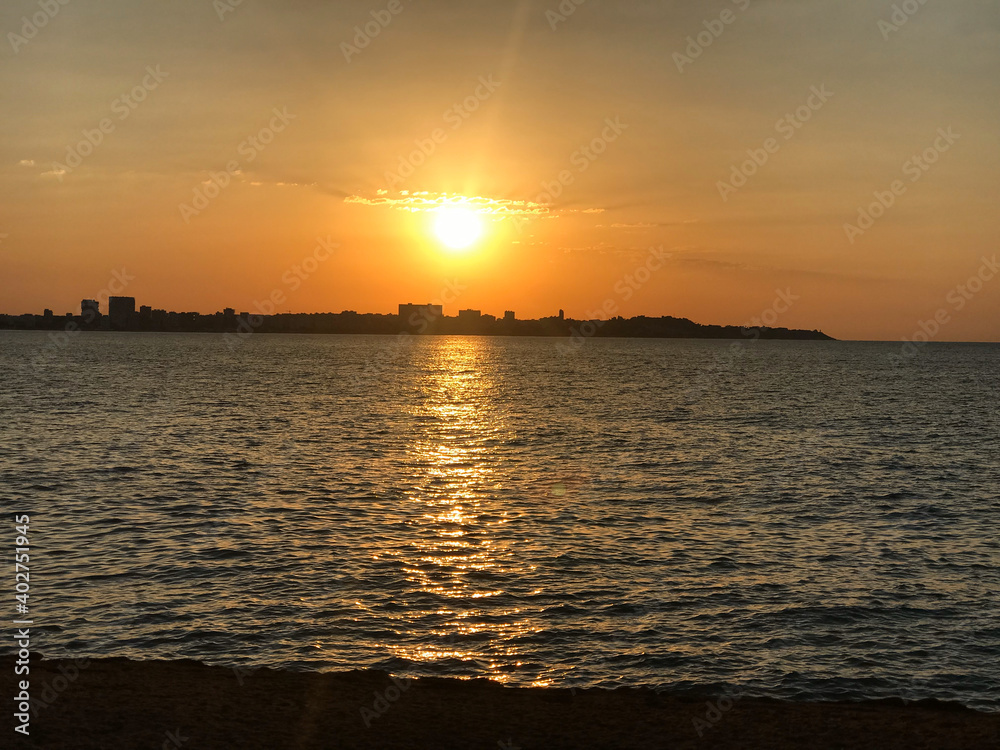 Beautiful and colorful sunset with cloud in the beach