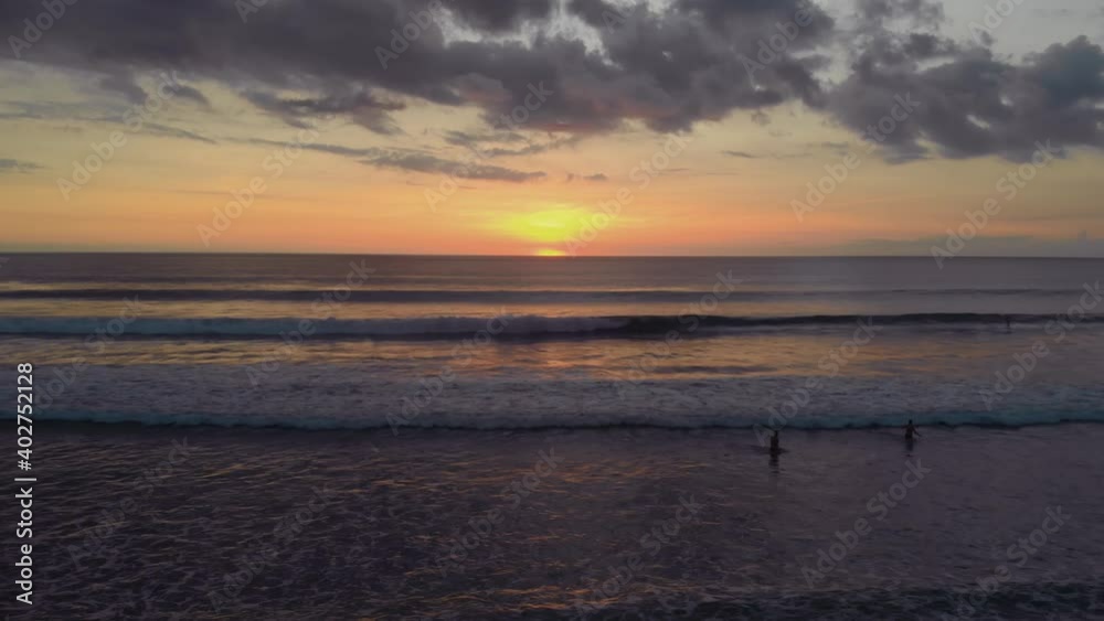 Flight at sunset overlooking the Indian Ocean in Bali Indonesia.