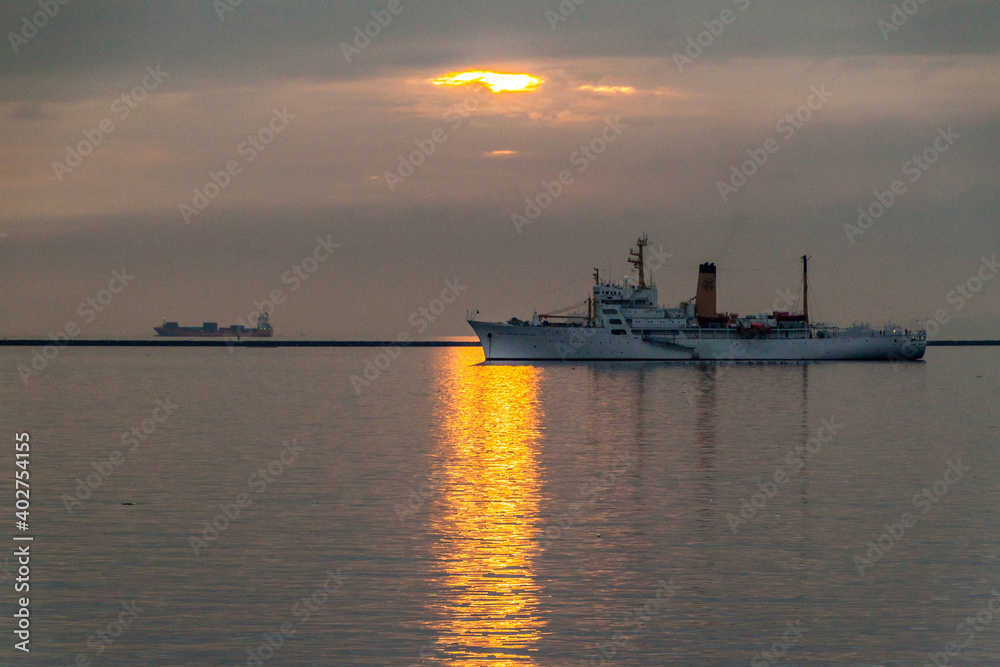 Sunset over ships near Manila, Philippines