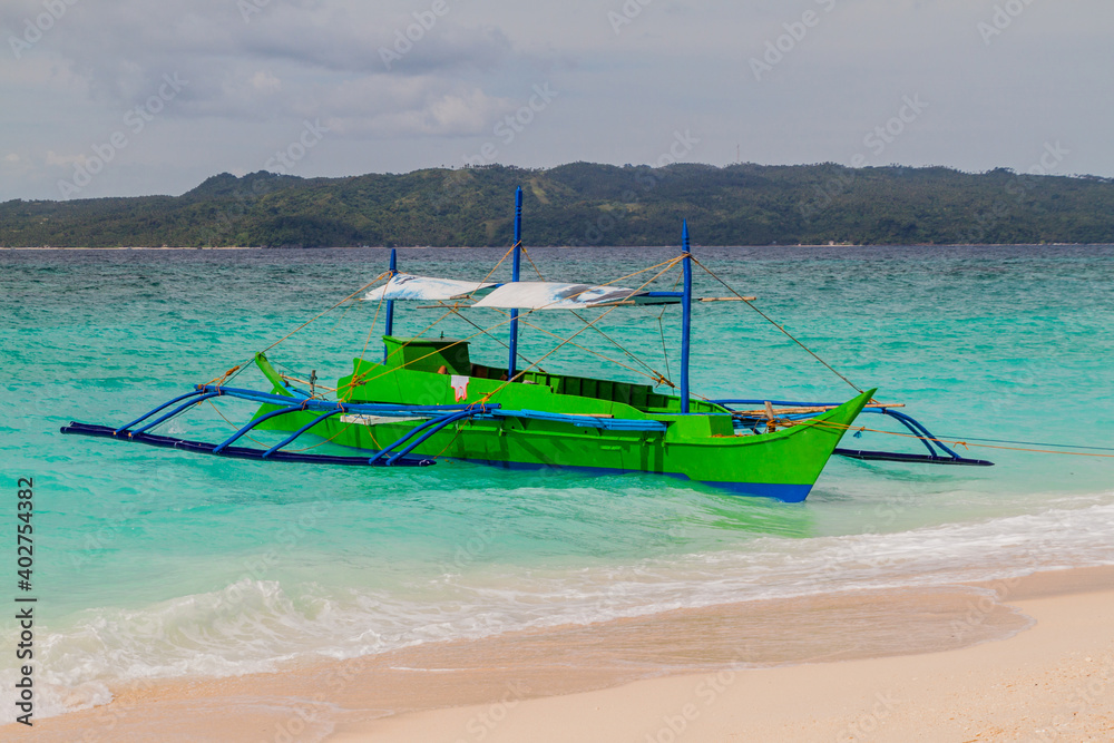 Bangka(paraw), double-outrigger boat at Boracay island, Philippines Bangka(paraw), double-outrigger boat at Boracay island, Philippines