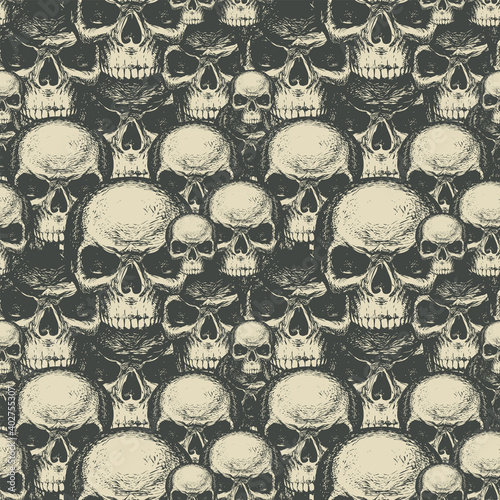 Seamless pattern with many human skulls. Repeating vector background with hand-drawn skulls. Graphic print for clothing, design element for Halloween, fabric, wallpaper, wrapping paper
