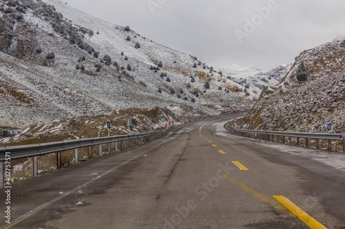 Winter snowy view of Road 875 between Quchan and Bajgiran, Iran photo