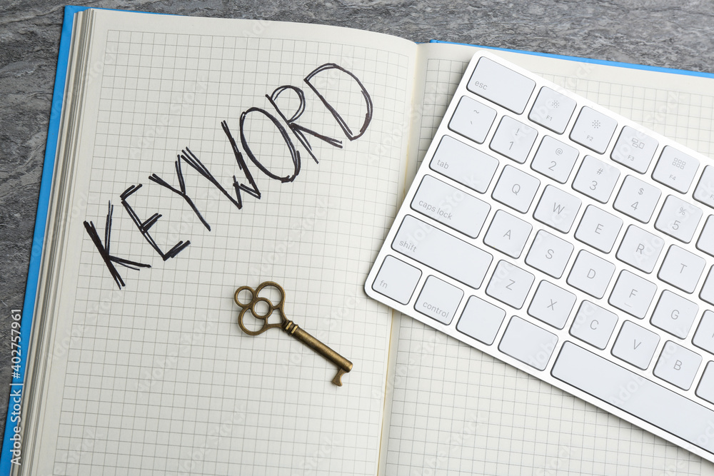 custom made wallpaper toronto digitalKey, notebook and computer keyboard on table, flat lay. Keyword concept