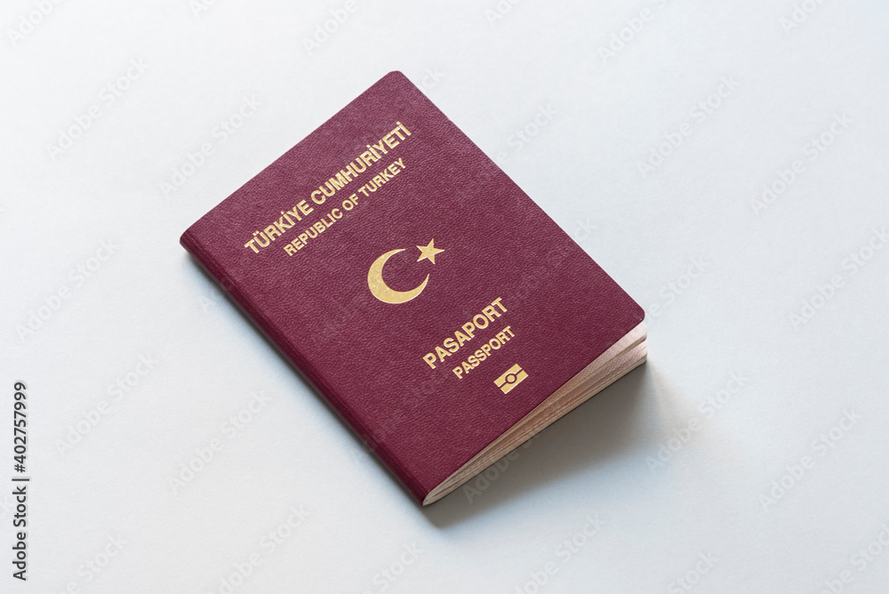 Turkish citizen public passport on the gray background. Turkish citizen public passport on the gray background.