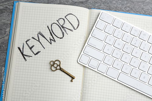 Wallpaper Mural Key, notebook and computer keyboard on table, flat lay. Keyword concept Torontodigital.ca